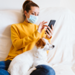 pet owner on phone with dog